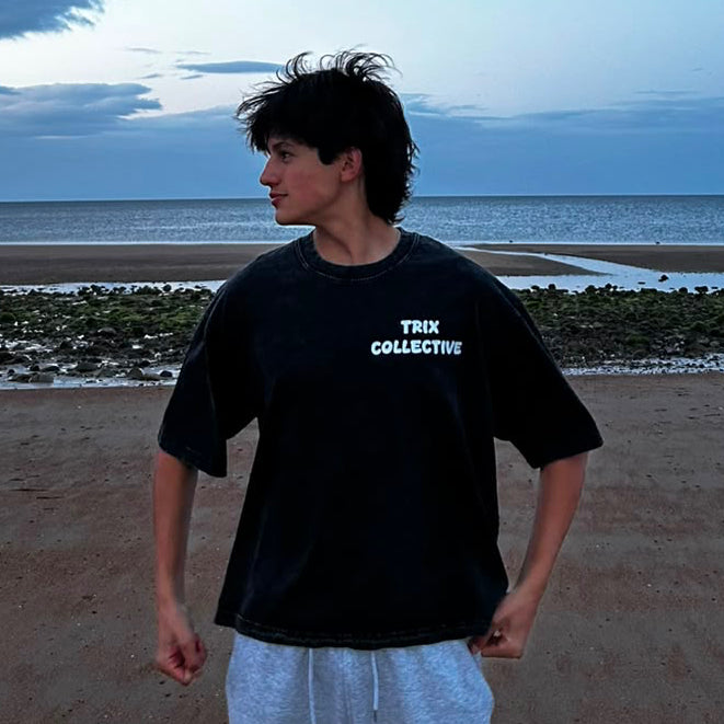 Snow Washed Oversized Cotton T-Shirt laid flat, showing the faded snow wash finish
